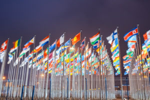 national flags of countries all over the world at night