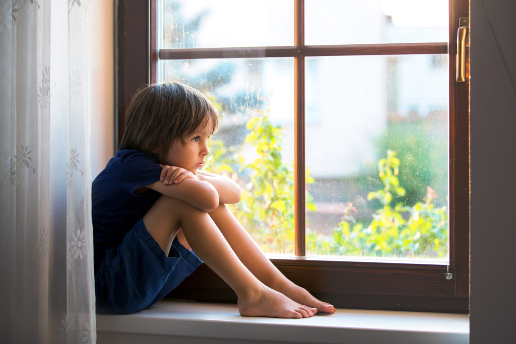 child in windowsill