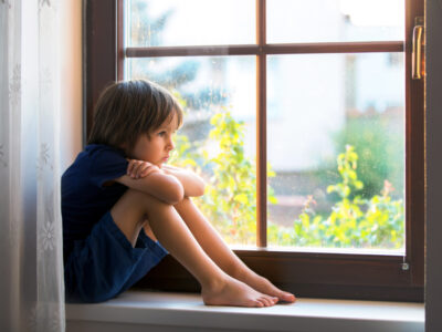 child in windowsill