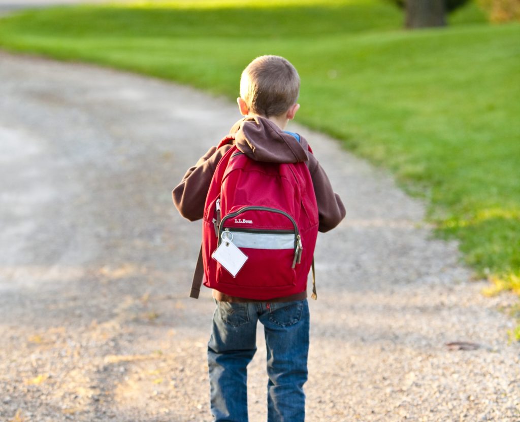 child with backpack