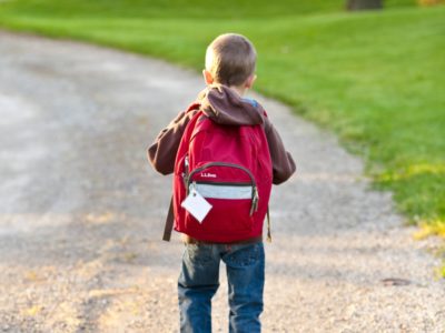 child with backpack