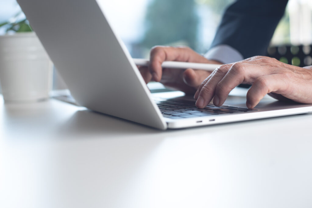 employee typing laptop
